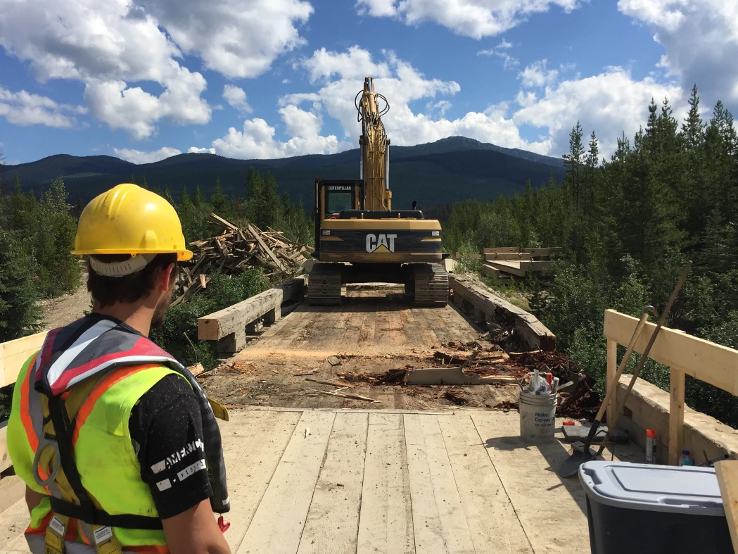 Bridge maintenance with excavator